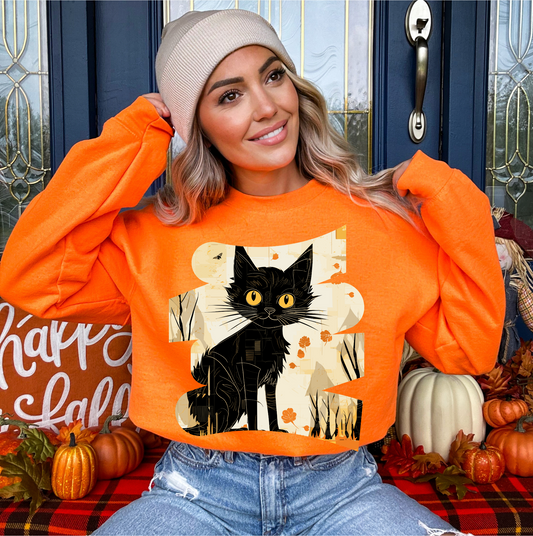 Explore our bewitching collection of Halloween sweatshirts, showcasing the mysterious allure of a black cat on the front.Sh