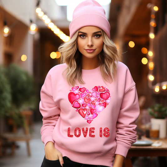 Embrace Love's Warmth: Introducing Heart of Hearts, 'Love is' Gildan 18000 Sweatshirts – Whimsical Designs, Cozy Comfort, Thoughtful Sizing.