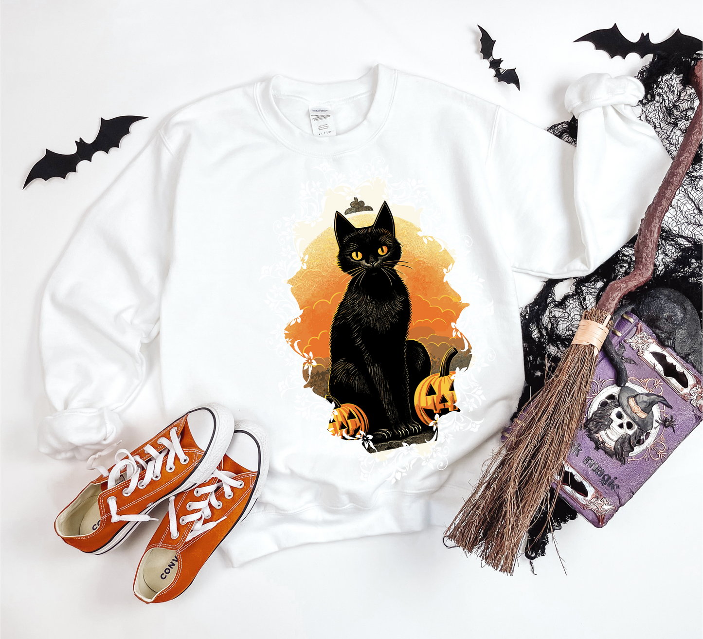 Explore our bewitching collection of Halloween sweatshirts, showcasing the mysterious allure of a black cat on the front.