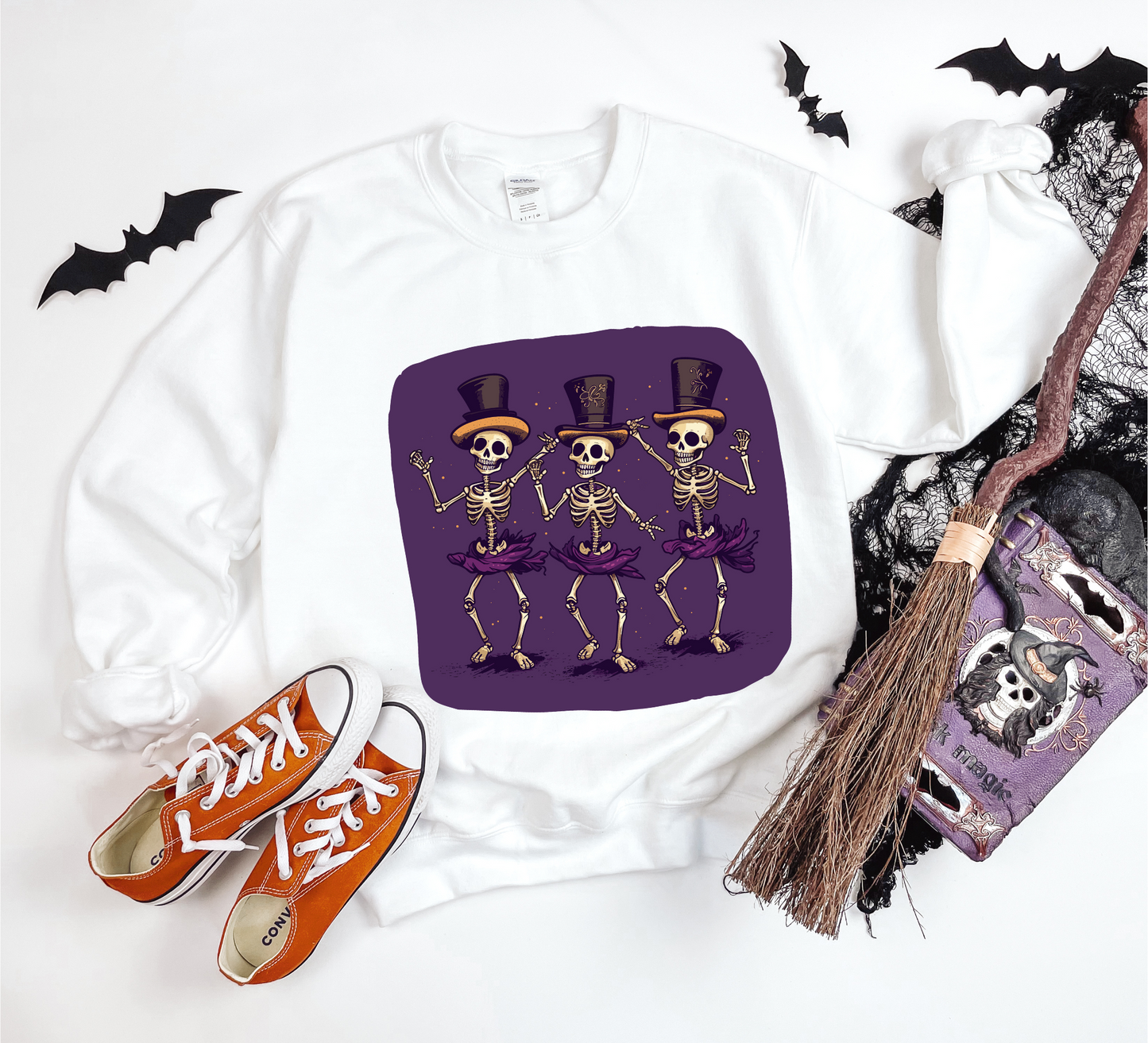 Explore our bewitching collection of Halloween sweatshirts, showcasing the mysterious allure of dancing skeletons on the front.