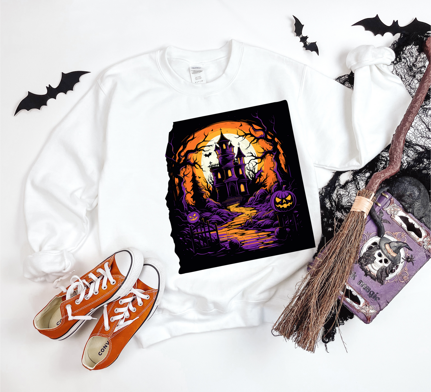 Explore our bewitching collection of Halloween sweatshirts, showcasing the mysterious allure of a haunted house on the front.