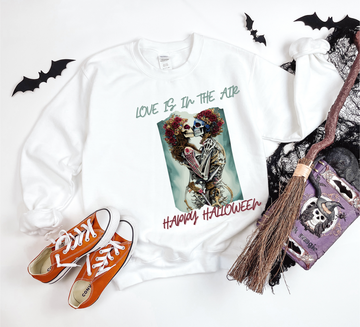 Explore our bewitching collection of Halloween sweatshirts, showcasing the mysterious allure of a skeleton lovers on the front.